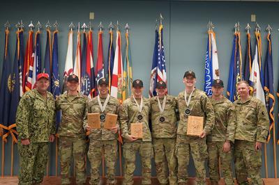 ֻ̳cadets receive award plaques at an Army ROTC pistol competition.
