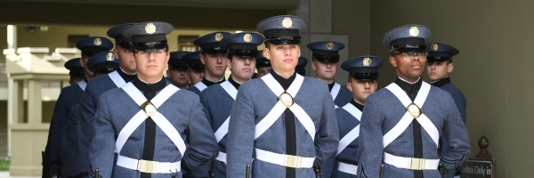 Uniformed members of the ֻ̳Corps of Cadets prepare to march out of barracks, what ֻ̳uses as a dorm for each cadet.