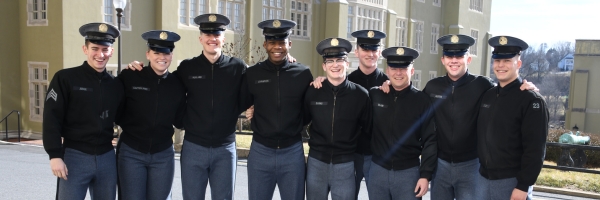 Students in the ֻ̳Corps of Cadets pose before classes. Each cadet wears the official ֻ̳uniform whether in barracks, class, or attending events on post.
