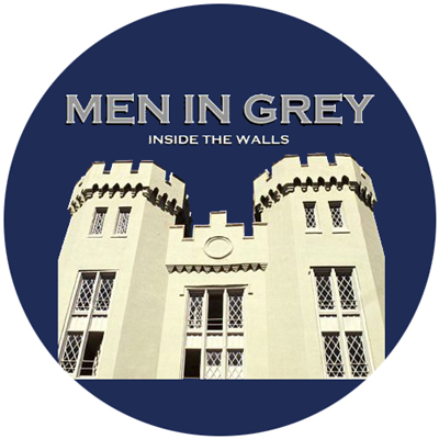 Men in Grey male acapella group logo circle showing ֻ̳building