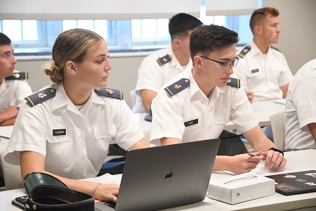 ֻ̳students, known as cadets, sit in a classroom during a course lecture.