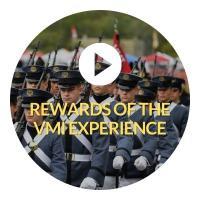 Button indicating click to play video about the Rewards of the ֻ̳experience. Button has of cadets in Parade 