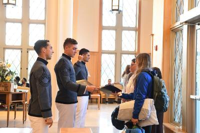 William Wallace ’22, Dane Hamilton ’22, and Kelly Rollison ’22 greet prospective cadets and their families in Lejeune Hall during Open House Oct. 15.—ֻ̳Photo by Kelly Nye.